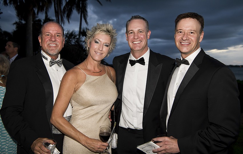 Gary and Laura Plum, Jared Hermann and Scott Bush