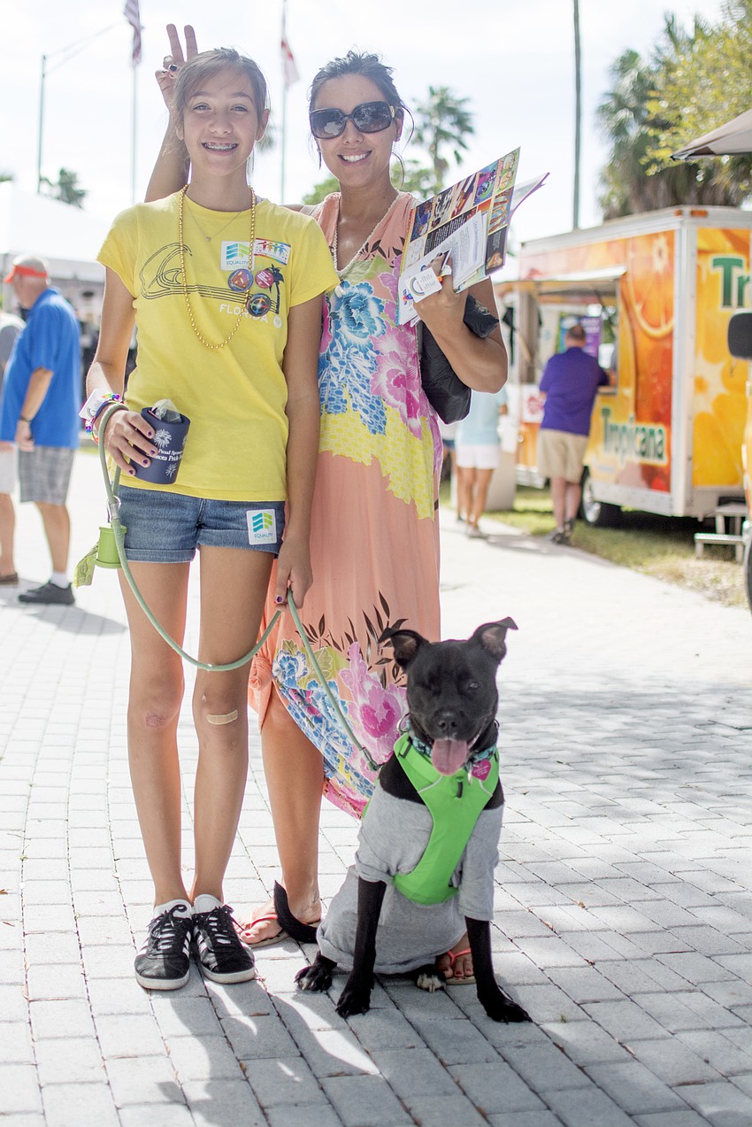 Harlow and Jennifer Warwick pose with dog Marina at Sarasota Pride Fest.