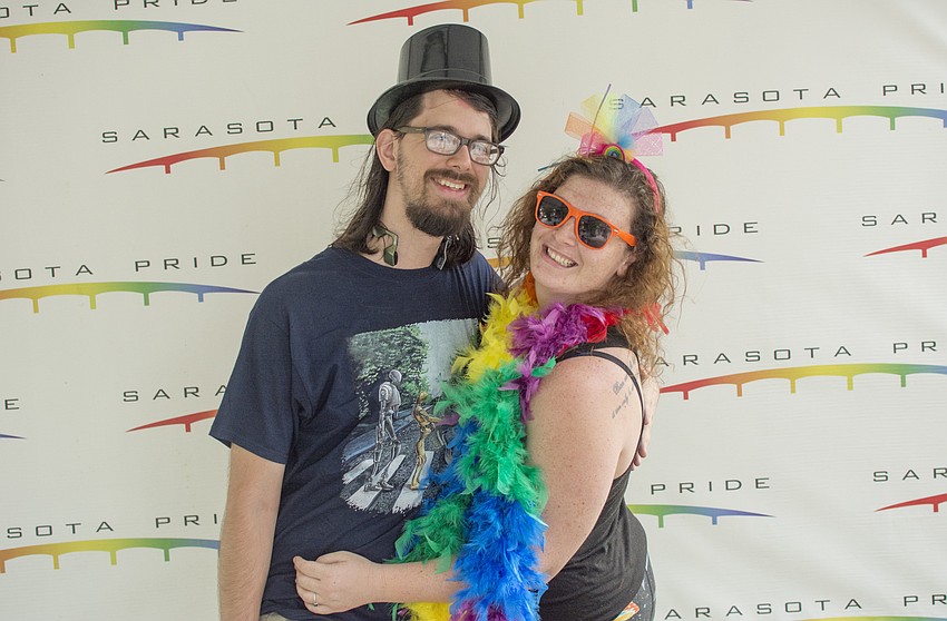 Mickey and Darcy Bennet pose in the photo booth during Sarasota Pride Fest.
