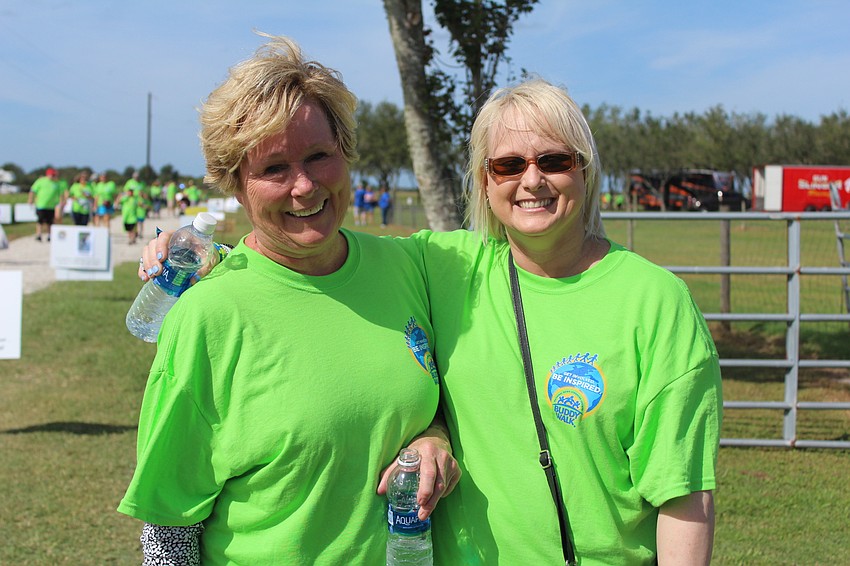 Sarasota's Marilyn and Michelle Cafaro power walk through the last stretch of the Buddy Walk.