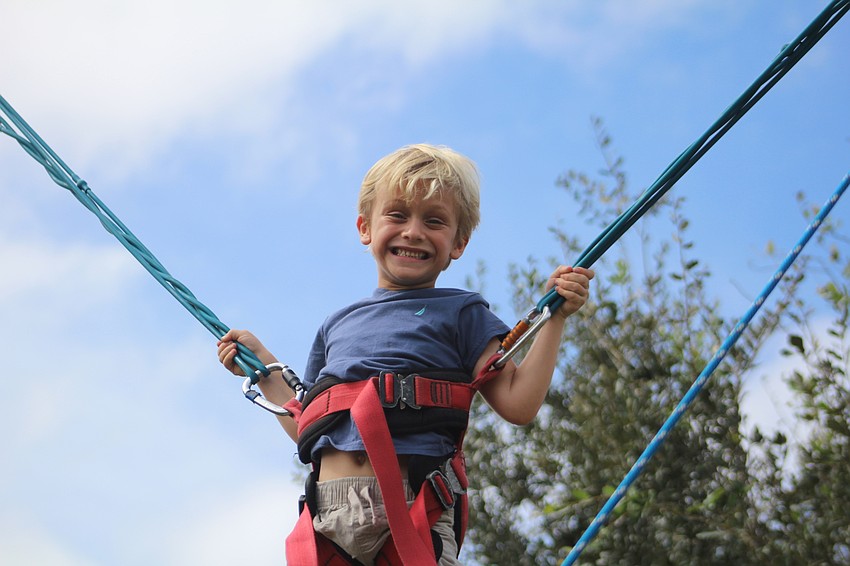 East County's Landon Finch tries out a bungee ride.
