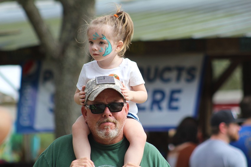 Venice's Hadley Dockus gets a ride from her grandpa, Craig Whitehead.