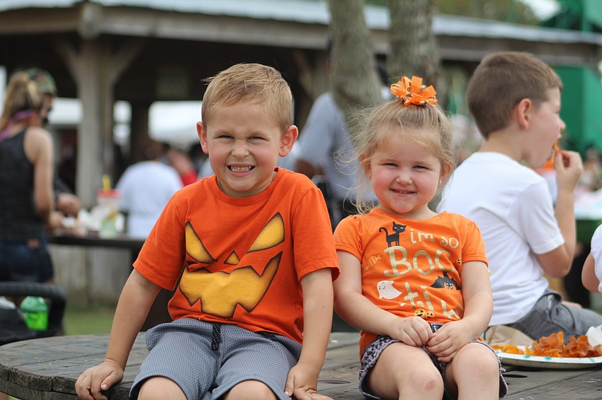 East County's Hudson and Avery Drake watch the monster truck show from afar.