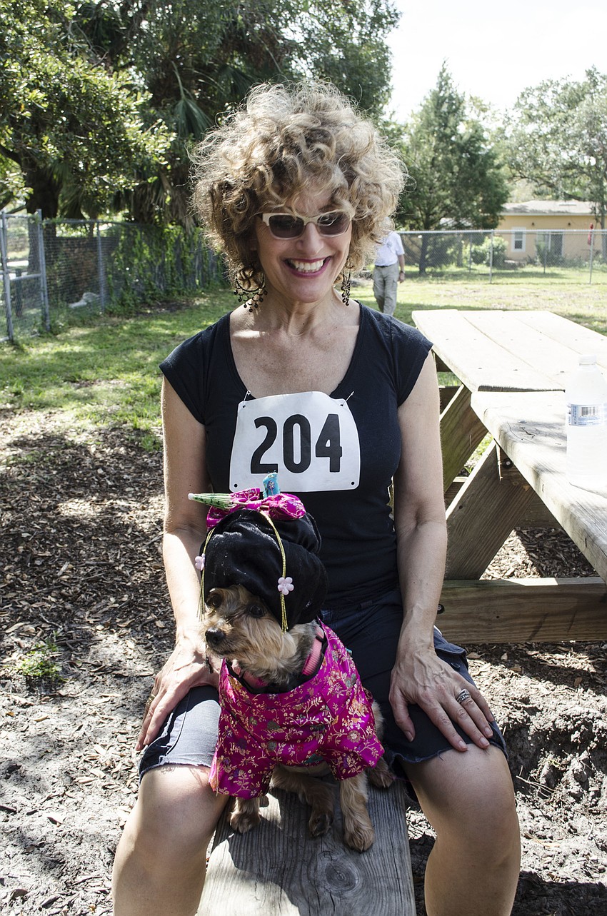 Heidi Kaplan and her dog, Charlie, won Most Creative Costume for their geisha outfit.