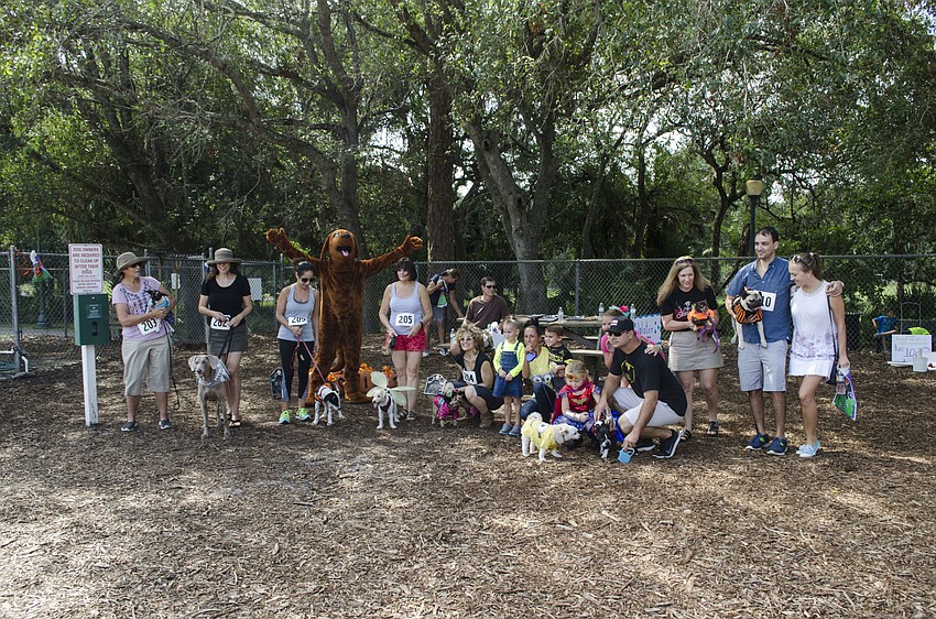 The whole crew gathered for a photo in Arlington Paw Park at Bark-O-Ween.