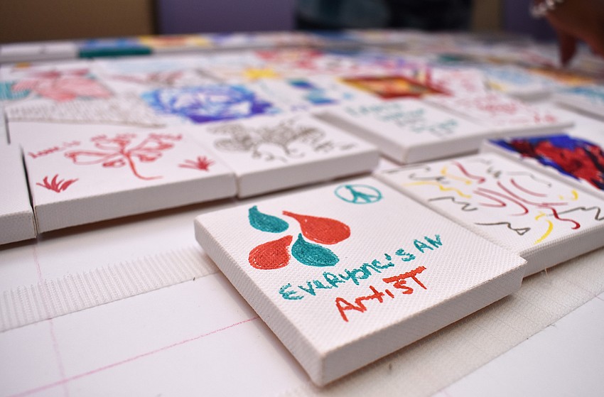 Guests drew or wrote what inspires them on small canvases that will be used to make a larger piece of art that will eventually hang in Art Ovation Hotel.