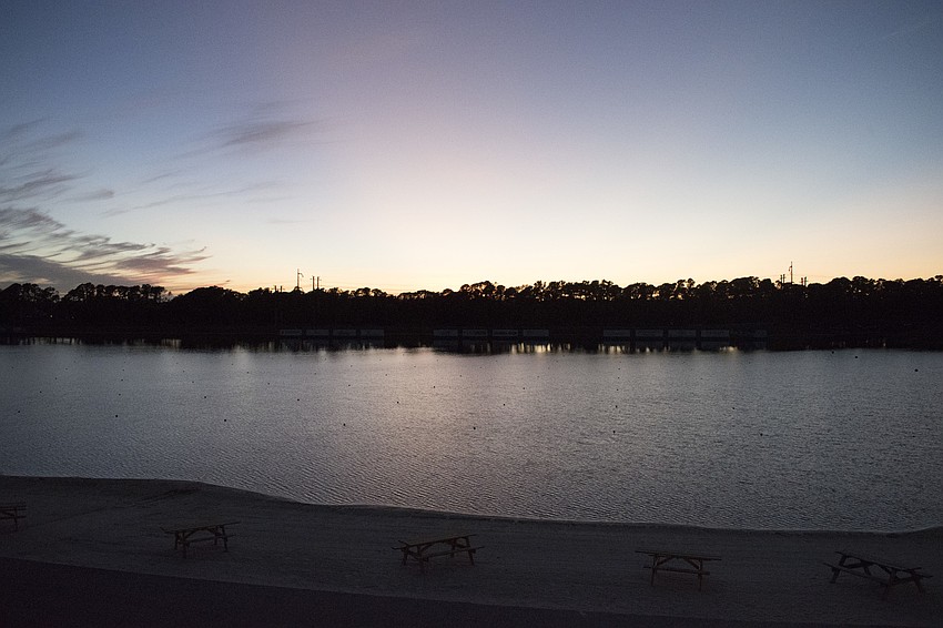 A colorful sky appears as the sun sets over Nathan Benderson Park.