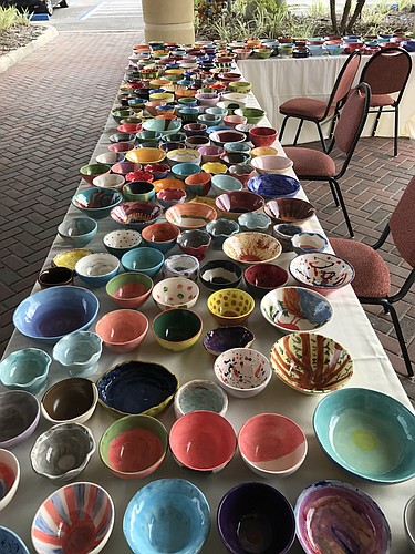 Attendees of the luncheon can pick out commemorative ceramic bowls such as those pictured here. Courtesy image.