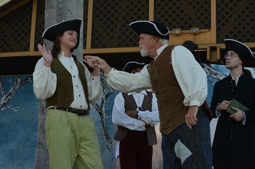 Brom Bones, portrayed by Andrei Nesterenko, gets a scolding for his mischievous behavior from Farmer Stuyvesant, played by Bob Fahey.