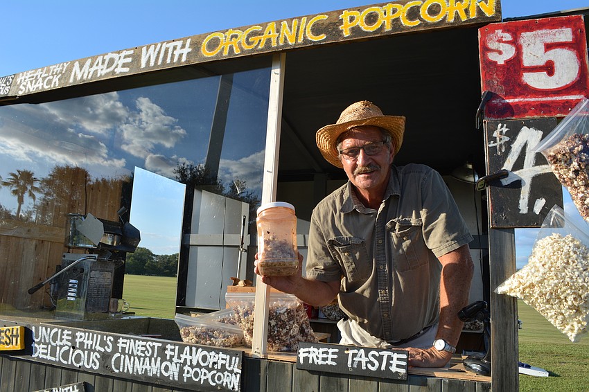 Phil Pagano sells his organic popcorn, including his secret-recipe cinnamon popcorn, before the show.