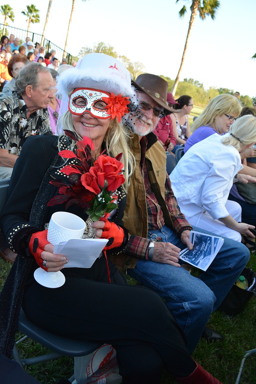 Debbie Rossi, with Mac Maclary, dresses as the bride of Frankenstein for the occasion.