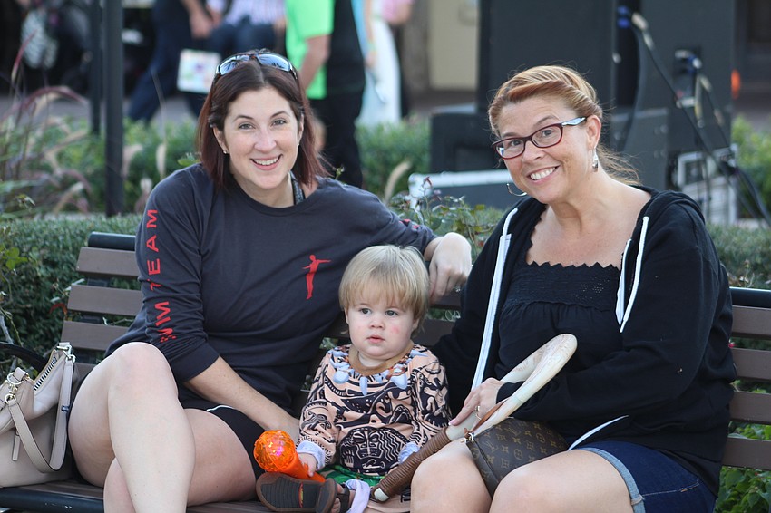 Lakewood Ranch's Jenn Fairchild, Tristan Fairchild and Tiffany Schlater take a break during Boo Fest.