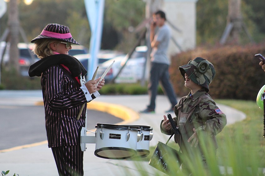 Parrish's Levi Hayworth and East County's Ben Inverso warm up on the drums before heading to Boo Fest.