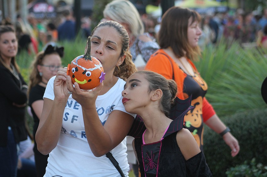 Parrish's Eunice and Allena Perez decorate a pumpkin.