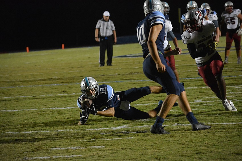 ODA senior wideout Ethan Bertrand corrals a catch in the first half of ODA's playoff win.