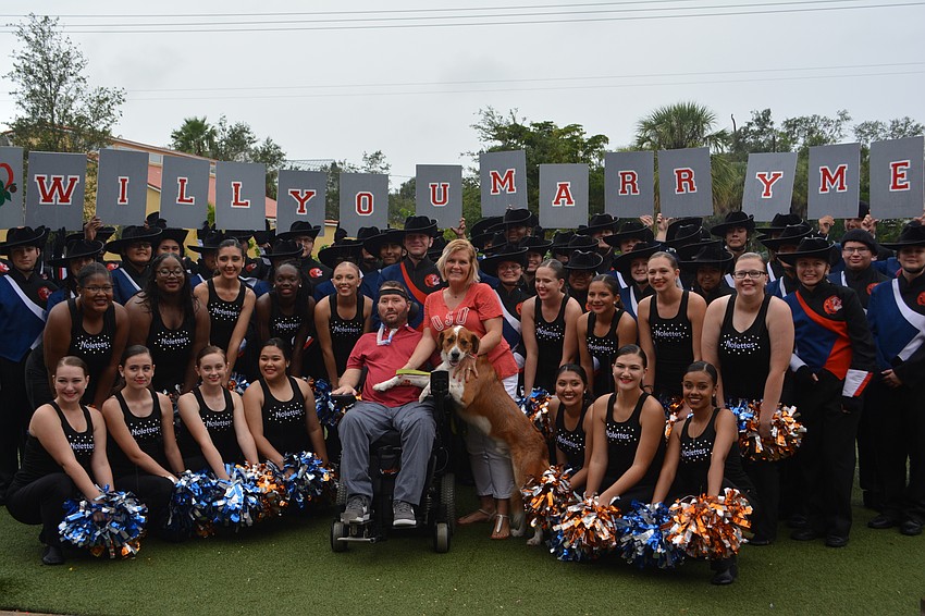The Southeast High School band braved a steady rain to help Lake Club's Kevin Swan ask Shaina Frisch a very important question on Oct 28 at the Mandeville Beer Garden in Sarasota.