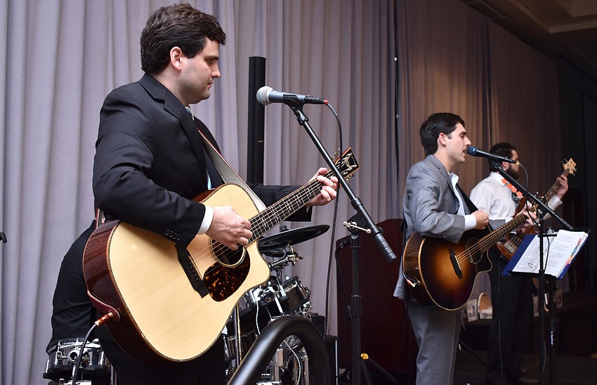 Live music by Fetch (pictured: brothers Chris, Victor and John Fetchero) kept the party going at the LECOM — Bradenton Student Scholarship Auction.