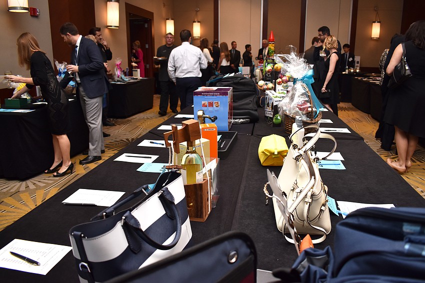 Tables upon tables of auction items lined the ballroom and the adjacent foyer.