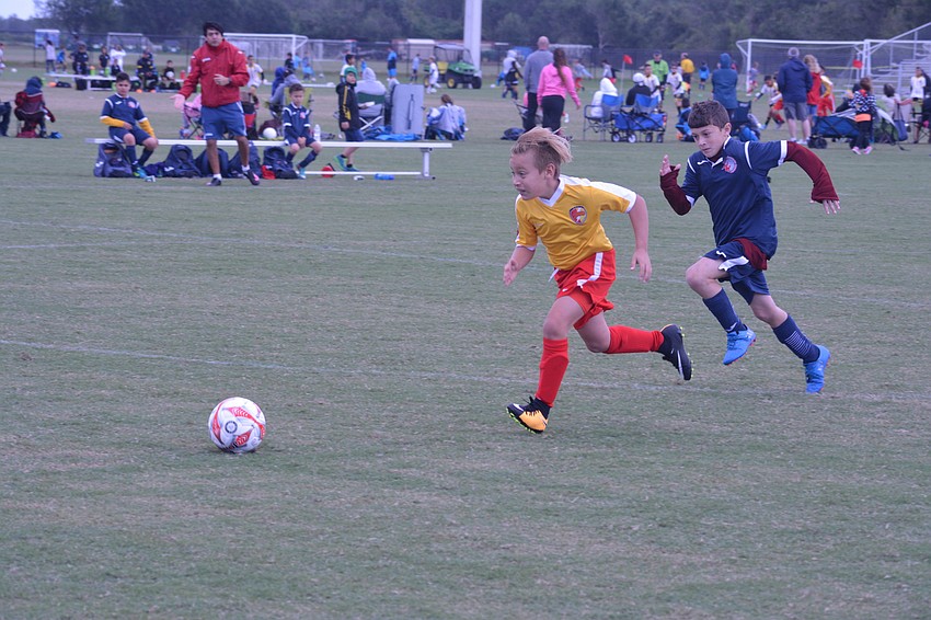 Lakewood Ranch U10 forward Joshua Rosenberg streaks down the field to win a loose ball. The Chargers lost 7-2 to KHL Eduardo.