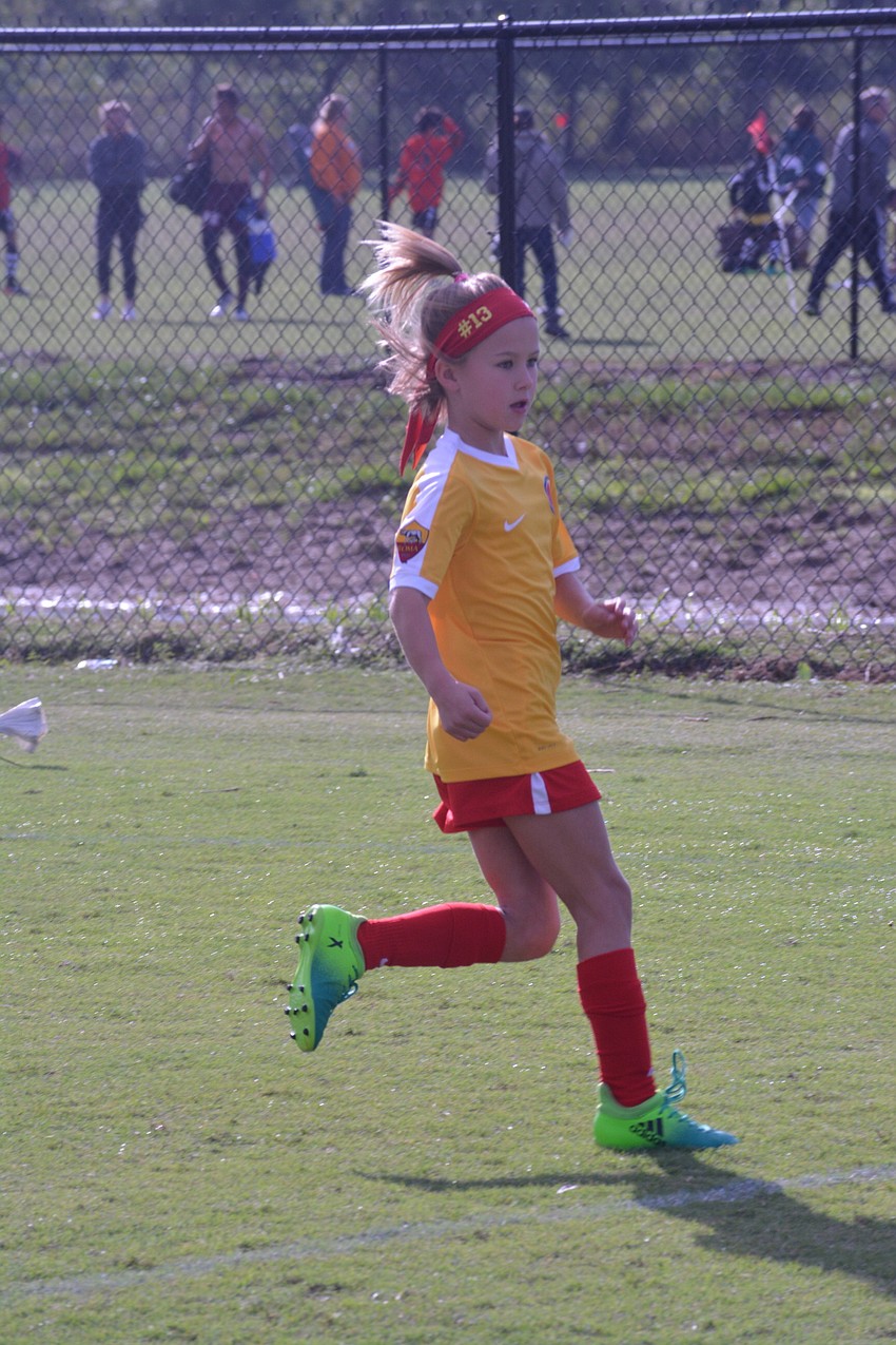 Karsyn Robbins chases down a Ives Estates Thunder attacker for the U9 Lakewood Ranch Chargers.