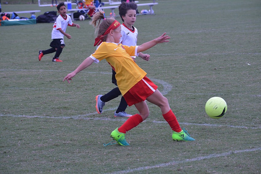Lakewood Ranch U9 defender Karsyn Robbins clears a ball out of the defensive zone.