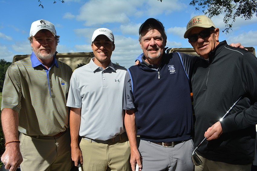 Lakewood Ranch's Daniel Rees, Crit Reddick and Michael Stone, joined Middlesbrough, England's Paul Whatmore to support Putts Fore Mutts.