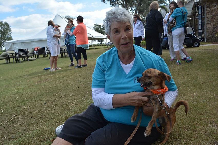 Volunteer Tricia Yandel plays with Jackson, a 1 1/2-year-old Chihuahua-Pug mix.
