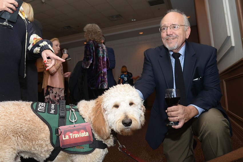 Paul Nucci pets Beau MCorkle