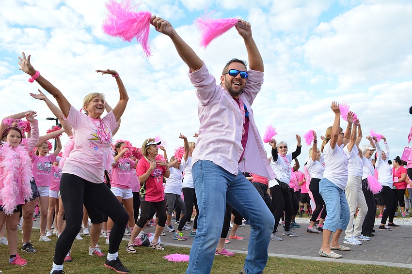 Jeff Golomb leads a flash mob for Team I Am Pink. He and his girlfriend, Rachel Hagoune, a survivor, have been doing the flash mob for three years.