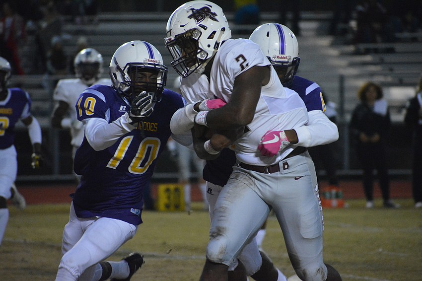 Braden River senior Deshaun Fenwick carries Booker defenders on his back as he streaks downfield.