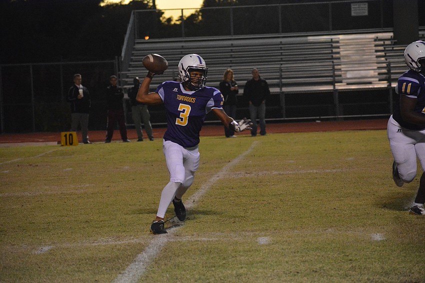 Booker senior quarterback Jermaine Ziegler rolls and throws to his right. He was held to 68 passing yards for the game.