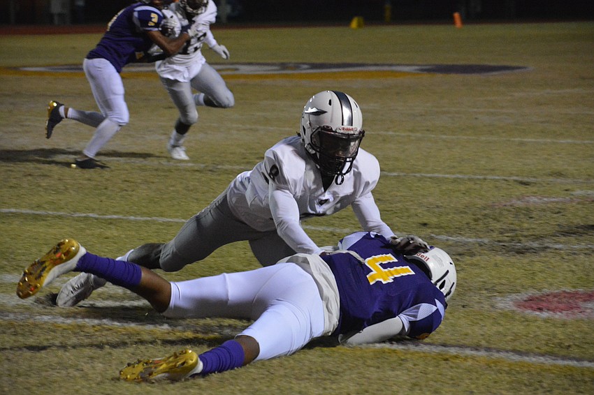 Braden River's Amari Pitts makes sure Booker's Talik Keaton is down after Keaton recovered a Tornadoes fumble.