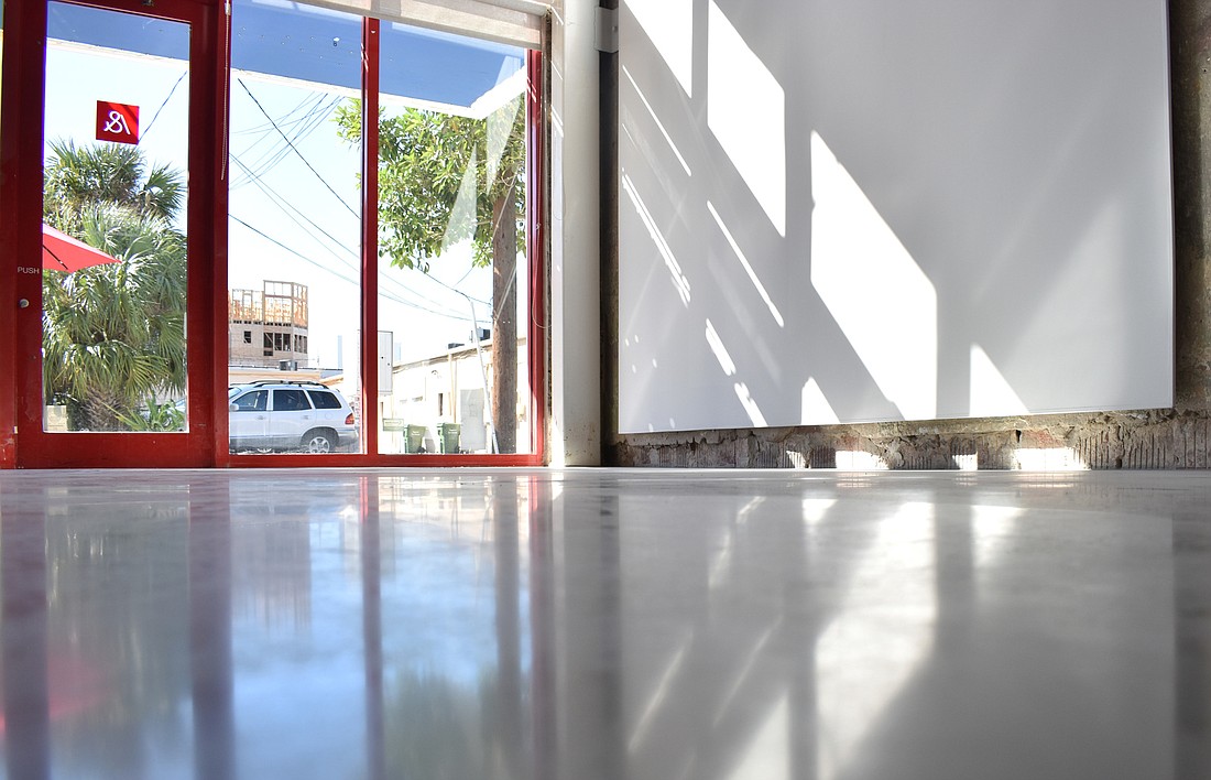 The renovations all started with the floor, which was previously a yellowing tile but  is now made of polished concrete. Photo by Niki Kottmann