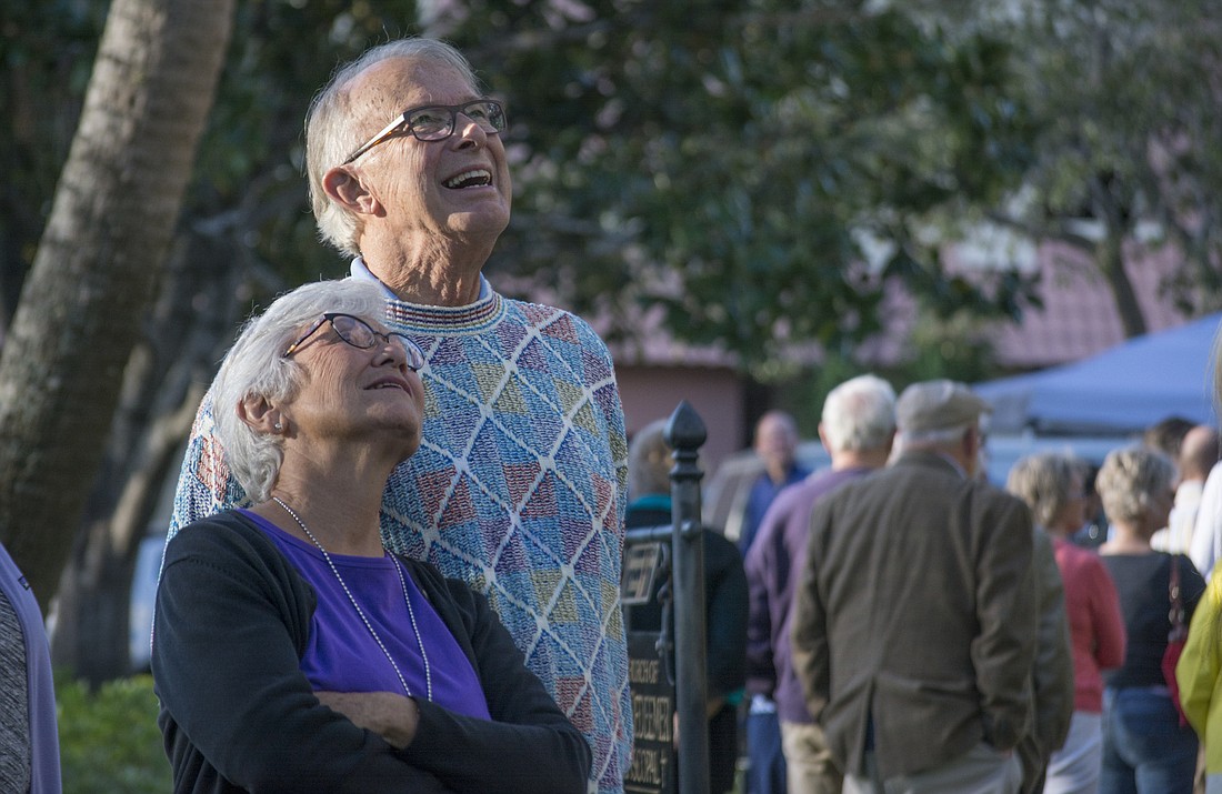 Edy and Tom Bulthuis watch the bells ring after a Sunday afternoon service of the Church of the Redeemer on Palm Avenue.