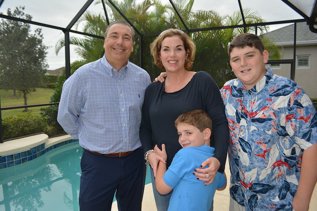 Keller Williams Realtor Gene Sherry, Lake Club&#39;s Kimberly Miele and her children Maximus, 7, and Jake, 13, enjoyed their House Hunters experience.