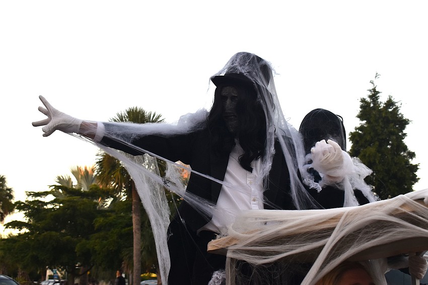 The Sarasota High School Drama Department students circled St. Armands as zombies.