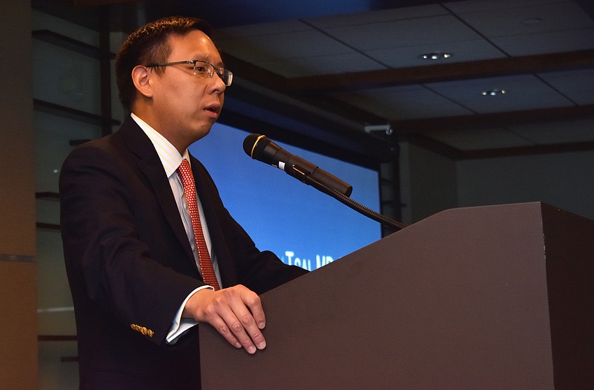 Dr. Kenneth Tsai speaks to guests about preventative measures against skin cancer.