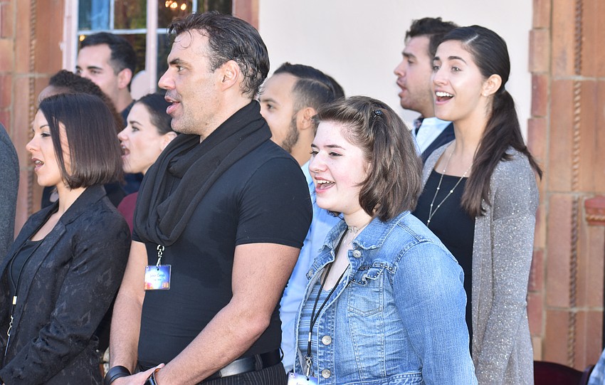 The ensemble performs “And the Money Kept Rolling In.”