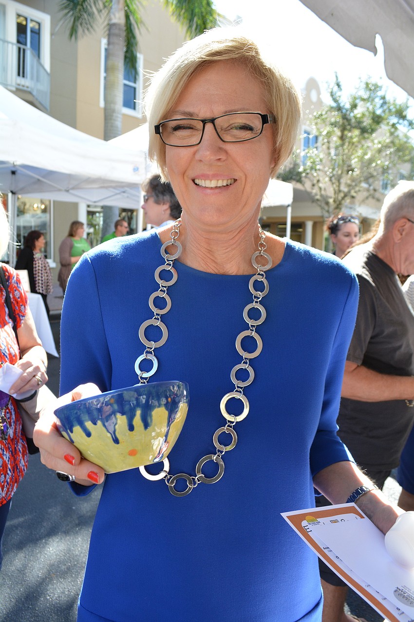 Neal Communties' Leisa Weintraub quickly finds a bowl she likes.