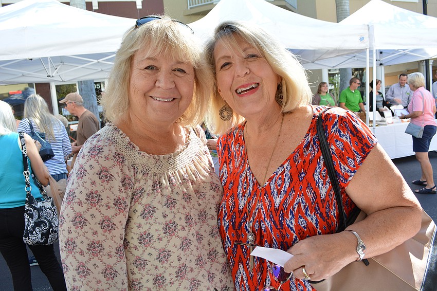 Pam Mader and Debby Jotham, of Sarasota, enjoy both the cause and the food.