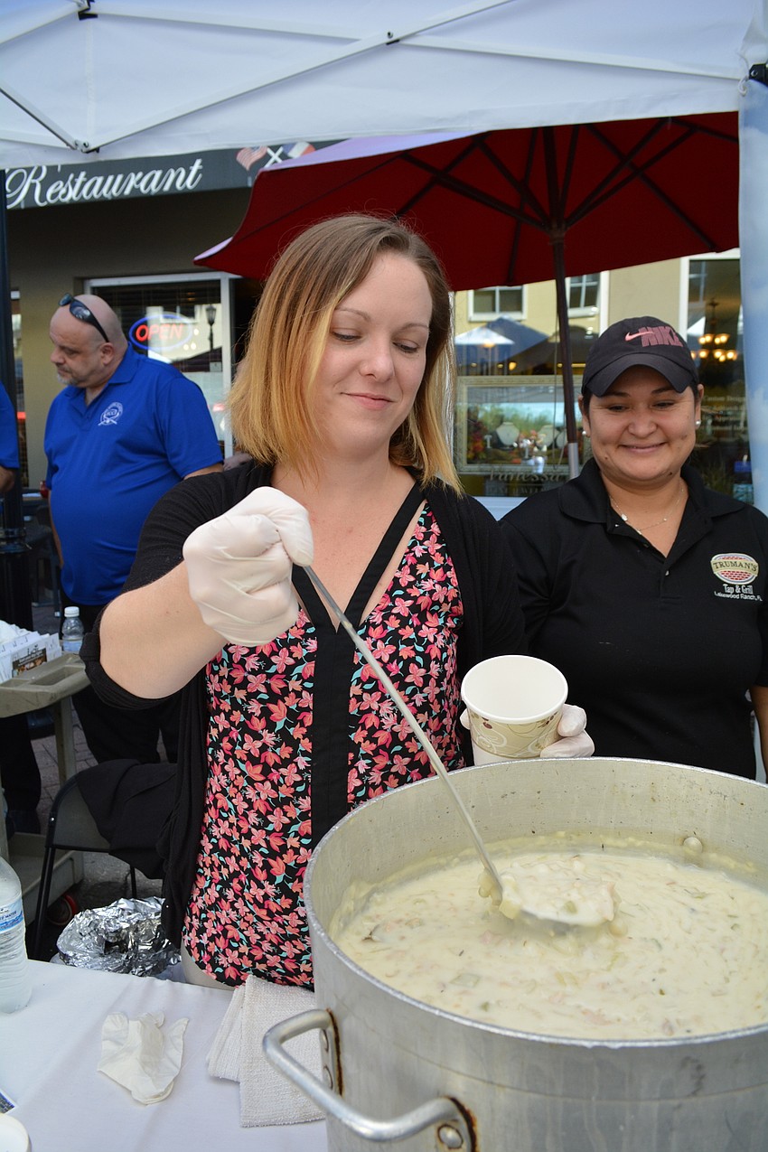 Deanna Weller, general manager of Truman's Tap and Grill, dishes out clam chowder.