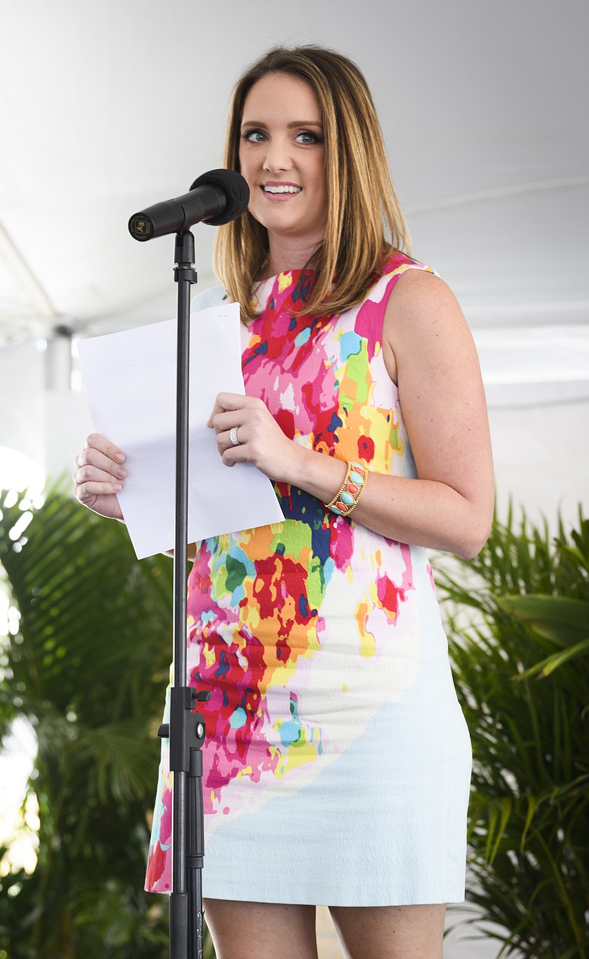 Fashion Show emcee Jen Rust welcomes the crowd.