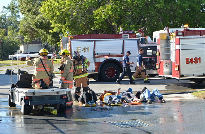 East Manatee Fire Rescue firefighters deliver critical patients to a pre-HAZMAT area so they can be rinsed of chemicals from a chlorine bomb.