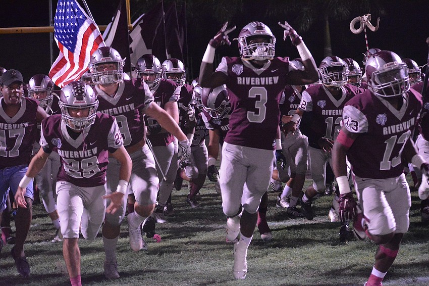 The Rams rush the field pregame.