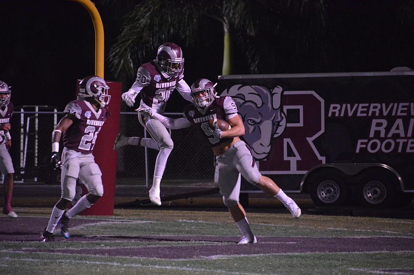 The Rams' Julian Lowenstein (9) celebrates a touchdown after Cleve Grantley blocked a Sailors punt.