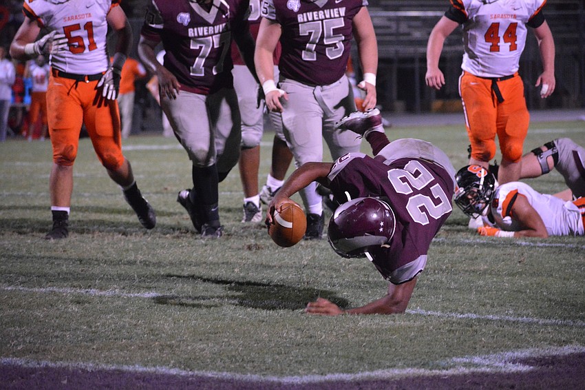 Rams running back Ali Boyce stumbles into the end zone.