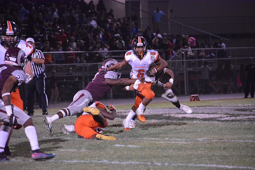 Sailors sophomore Brian Battie breaks a tackle in the second half.