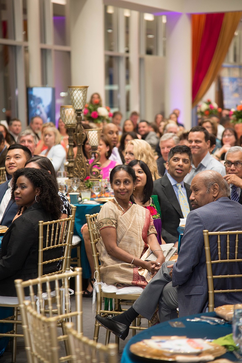 Guests enjoy speakers and dancers.