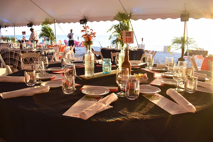 Each table was adorned with simple yet elegant floral centerpieces.