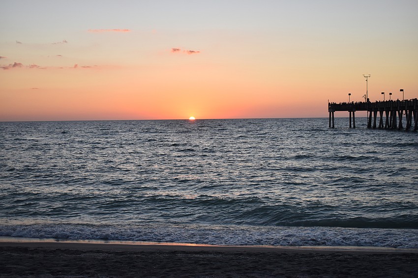 Guests watched the sun set over the Gulf of Mexico before sitting for dinner.